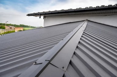 Metal roof installation with a sloped design